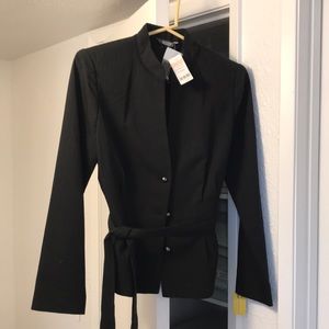 Black Wanko blazer. Size 38 or small. It still has the original price $580.00.